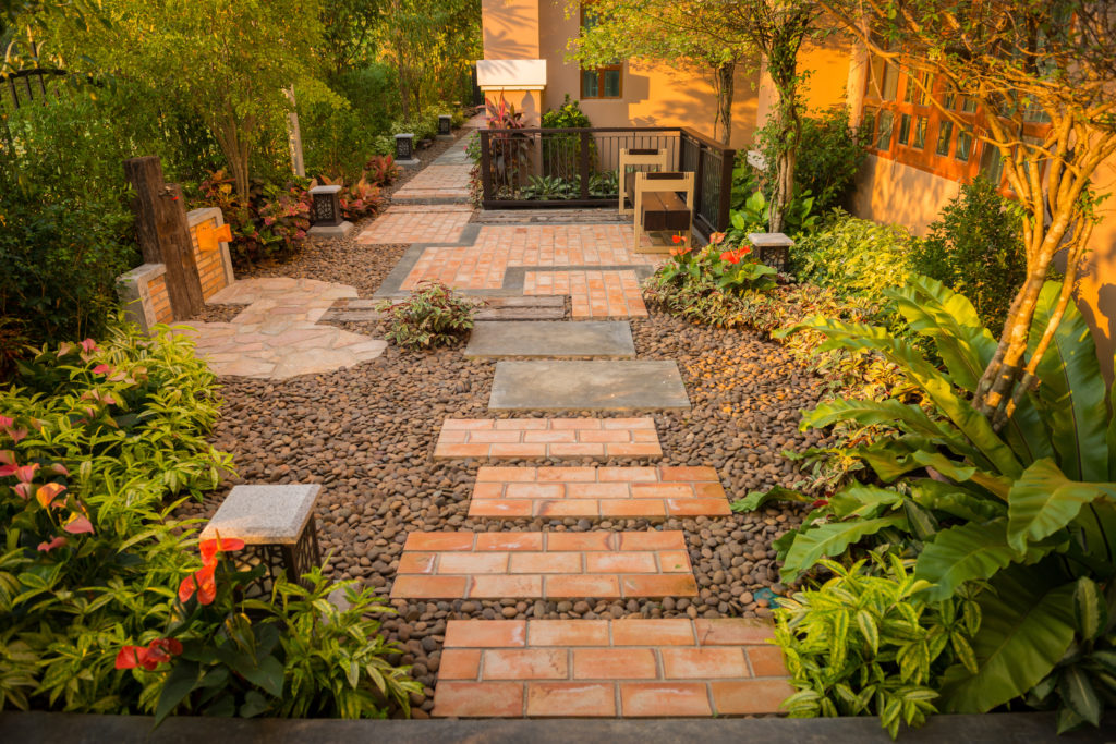 a beautiful garden with decorative gravel