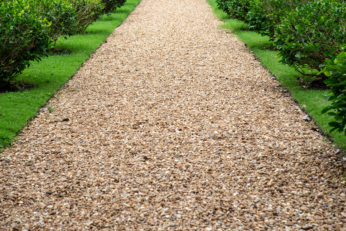 A gravel path through greenery in Hobbs.